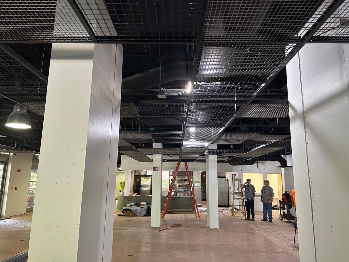 Commercial interior buildout with metal framing and a grid ceiling in progress in Austin, TX