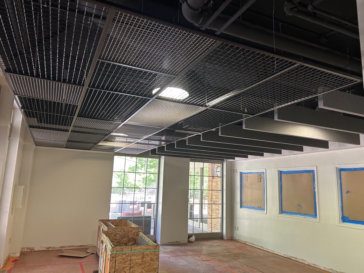 Metal grid ceiling with black acoustic baffles in an Austin, TX commercial space